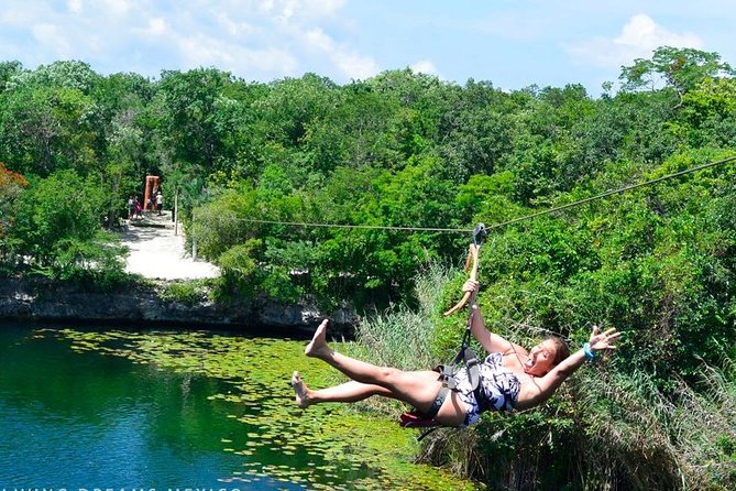 4 Private Cenotes, Zip-Lines, Canoes & Mayan Village with Delicious Lunch - Zip-lines and cliff jumps in the jungle