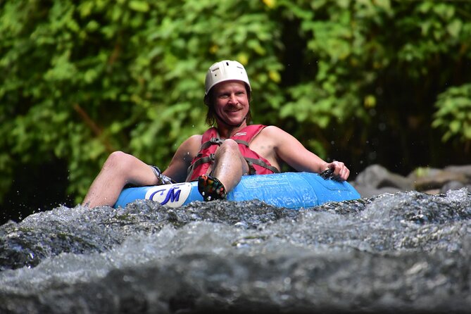 Arenal Volcano Combination Tour: Zipline, Tubing and Hot Springs - Tubing the Arenal River rapids