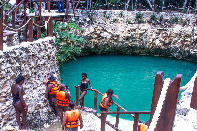 ATV's (shared), Ziplines & Cenote! Half-Day with Transportation from Cancun - Cooling off in the cenote