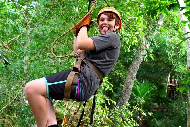 ATV, Ziplines and Cenote swim experience from Cancun or Riviera Maya - Flying over trees on the zipline circuit