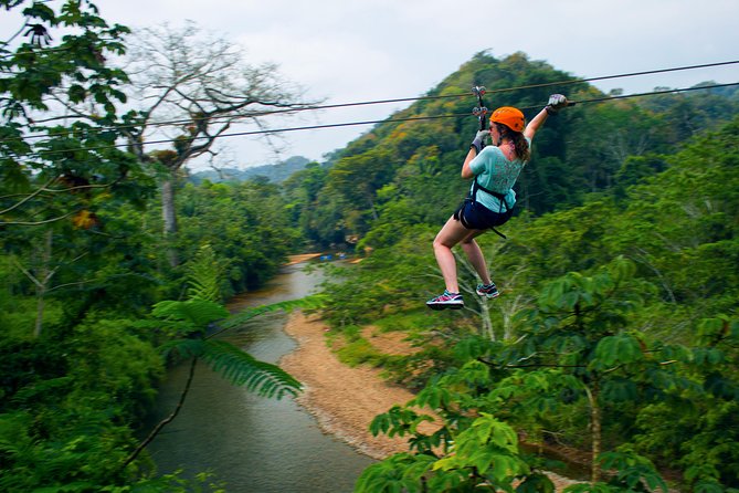 Cave Tubing & Zipline Adventure with Lunch - Ziplining above the rainforest