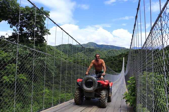 Combo ATV Jorullo Bridge + zip lines + mule ride - Crossing the Jorullo Bridge above the Cuale River