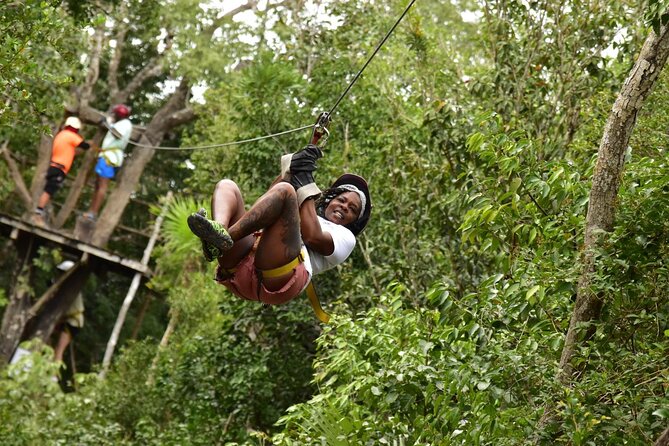 Complete Shared ATV Tour Horse Zip Lines Cenote and Lunch - Riding the ATVs through the park