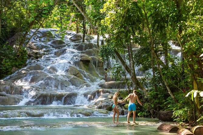 Dunns River Falls, Zipline, Bamboo Rafting, Horseback Ride Tour - Horseback riding from land into the Caribbean Sea