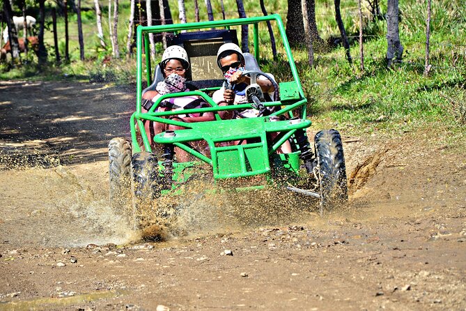 Full-Day La Hacienda Dune Buggy with Zipline & Horseback Activity - Dune buggies on a muddy course