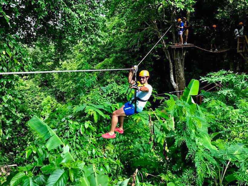 Phuket: ATV and ZipLine Adventure View Big Buddha Visit - Riding an ATV through forest, plantations, and mud