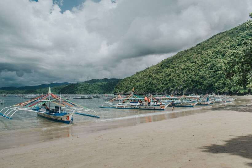 Puerto Princesa: Underground River, Zipline, Paddleboat Tour - Filipino lunch beside Sabang Beach
