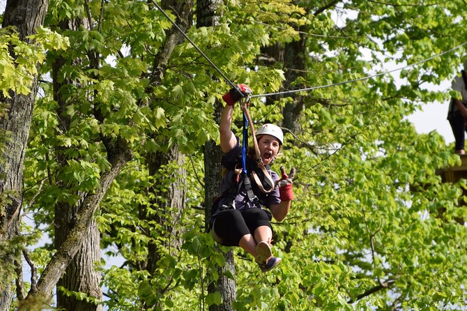 Wildman Zip Line Tour - Five lines through the trees and beside the river