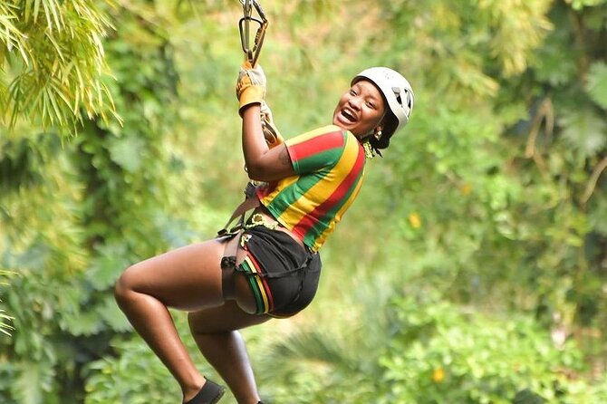 Zipline, Dunn’s River Falls, Bamboo Rafting & Horseback Ride Tour - Climbing Dunn’s River Falls and flying above the water
